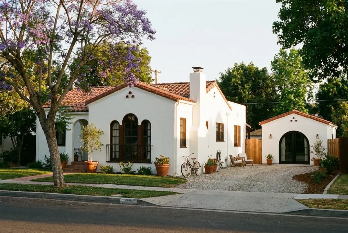 A restored 1920s Spanish Revival house on a tree-lined Fullerton street