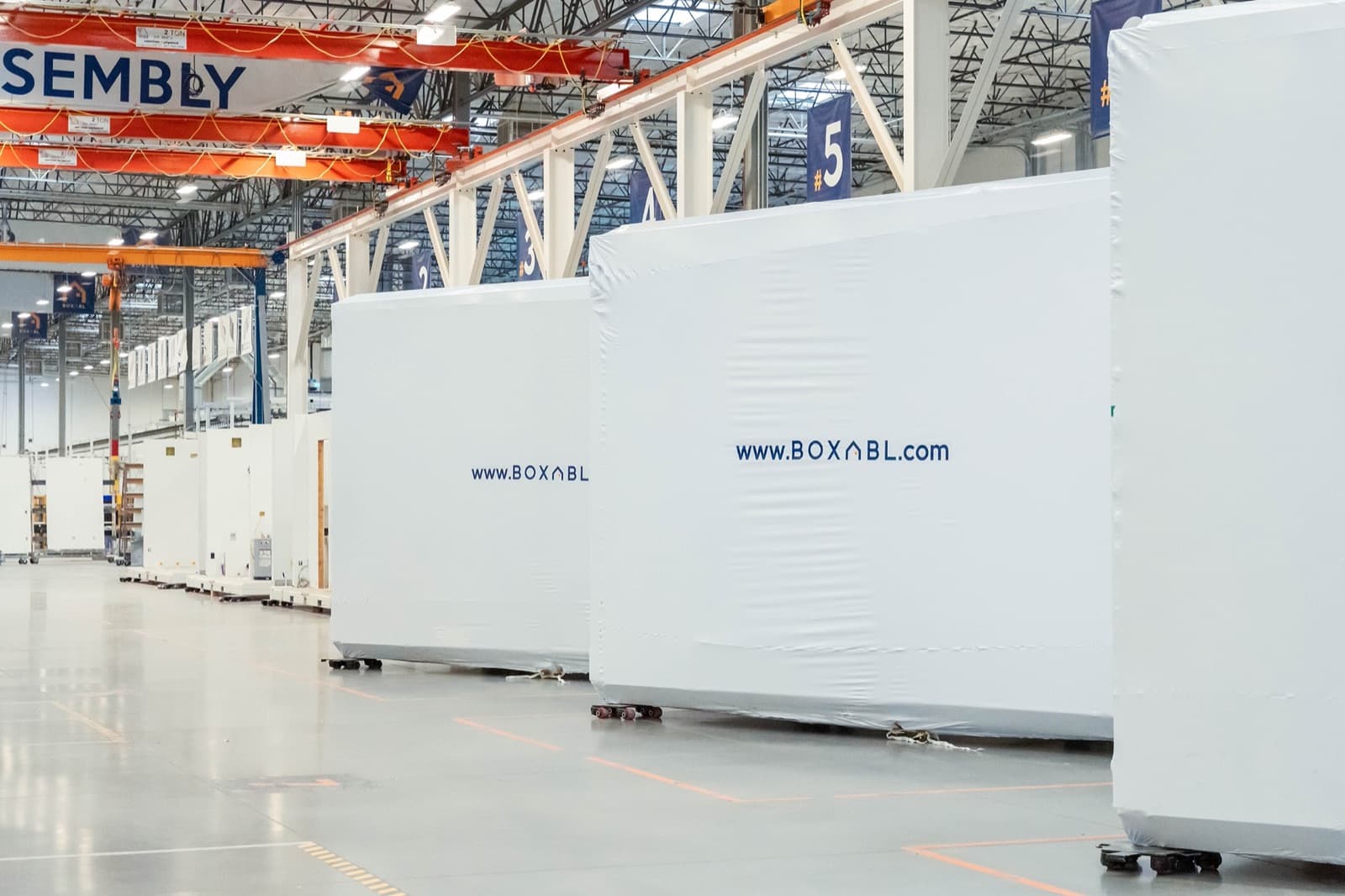 Folded Boxabl Casitas at the end of the factory assembly line