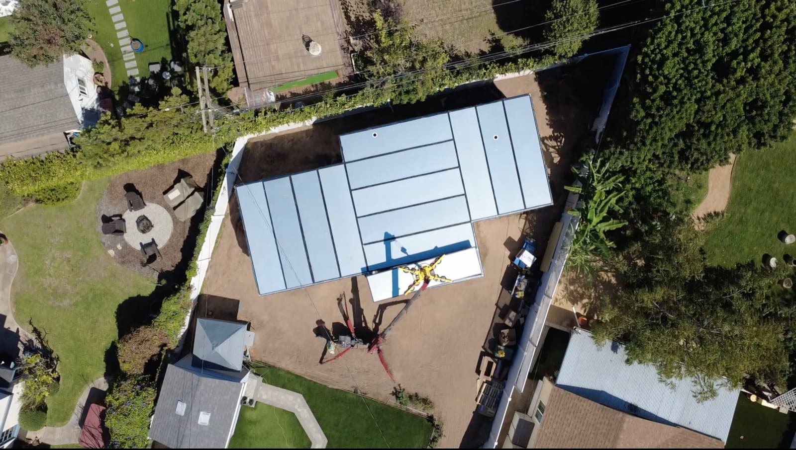 Aerial view of a Cover ADU being installed in a Redondo Beach backyard