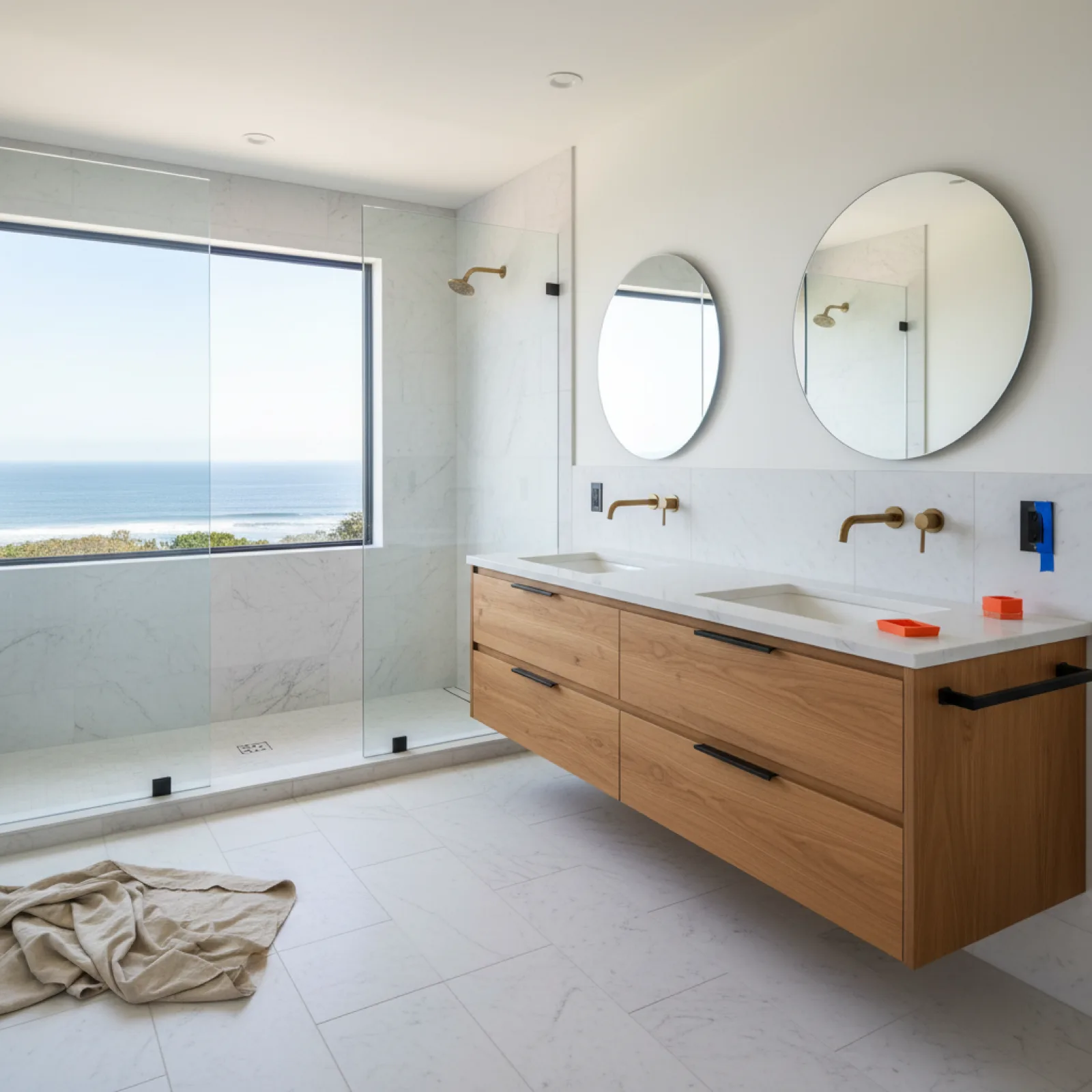 Completed mid-range primary bathroom remodel in La Jolla CA (2026) with honed marble floor, curbless walk-in shower, and teak double vanity