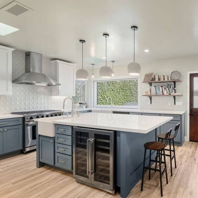 Blue cabinetry, crisp white finishes, and a statement island that steals the scene.