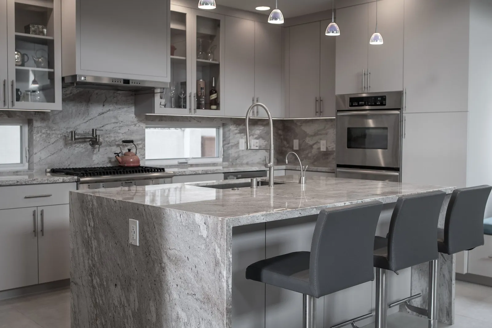 Kitchen remodel with a waterfall stone island, Manhattan Beach