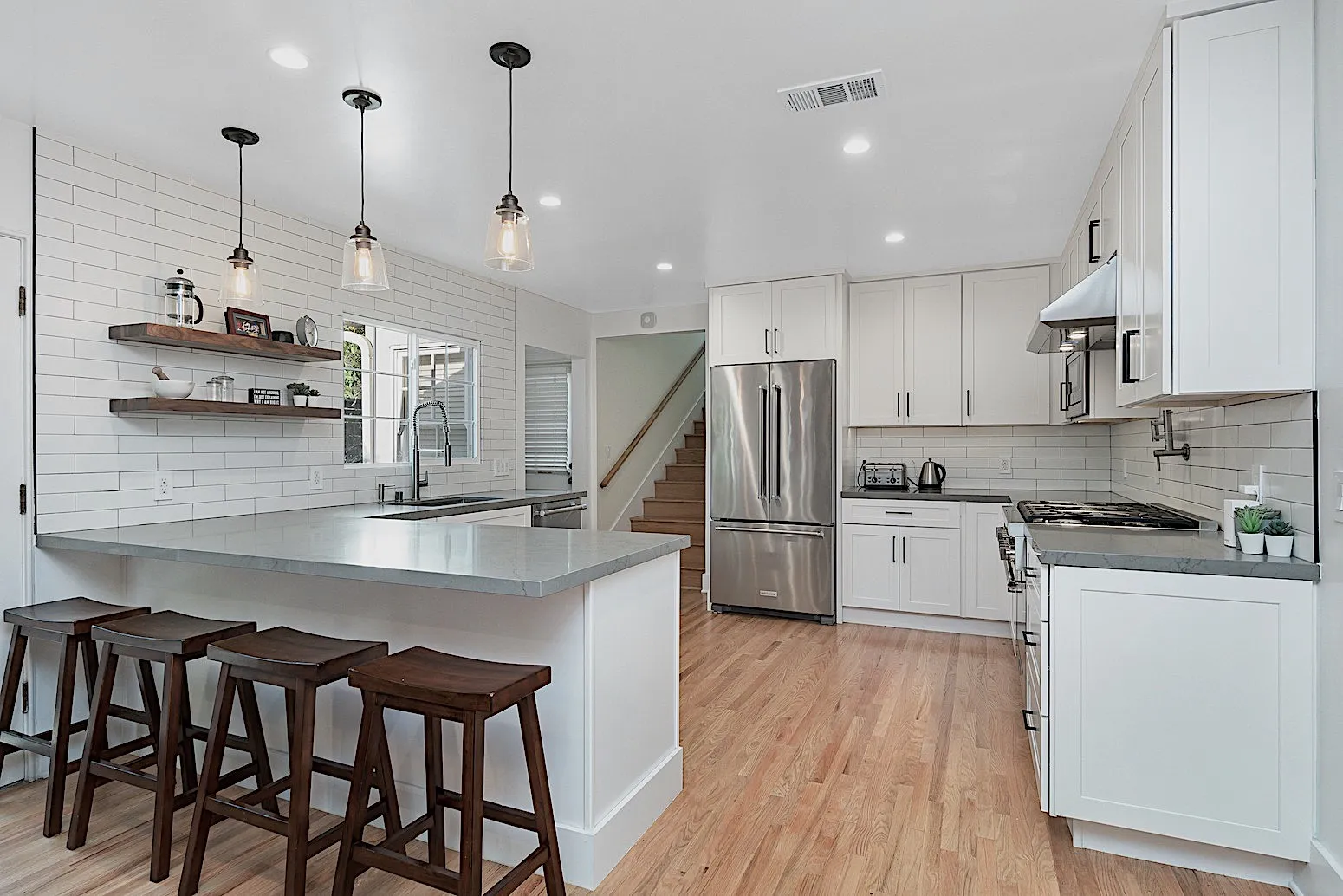 Kitchen opened up with a peninsula and open shelving, Marina del Rey