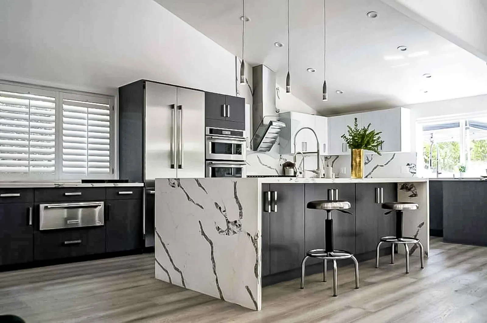 Kitchen remodel with dark cabinets and waterfall island, Calabasas
