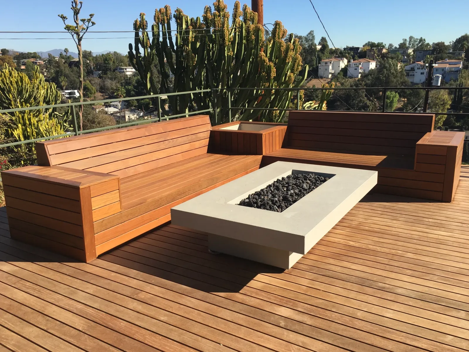 Built-in wood benches around a fire table