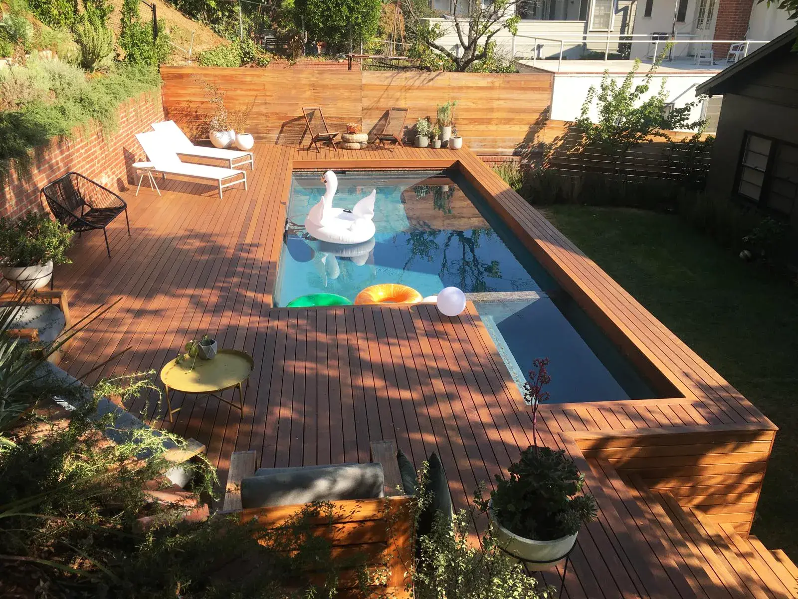 Hardwood deck around a raised pool