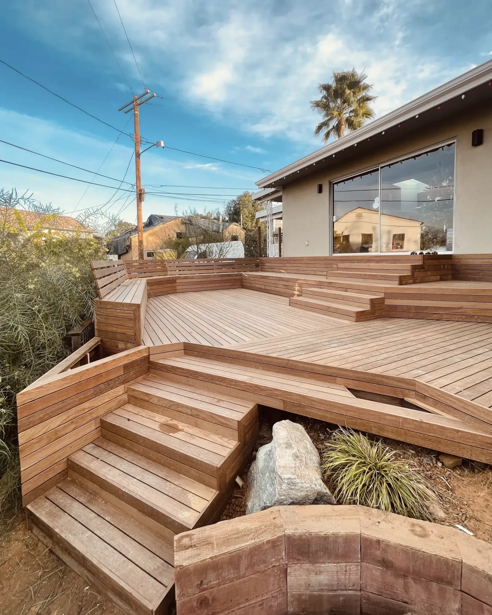 Curved deck steps on a sloped backyard