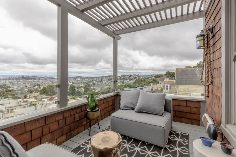 Covered deck with pergola and bay views