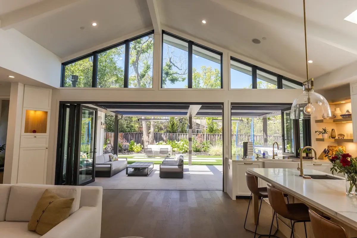 Great room opening to a covered patio and backyard, new home, Los Altos