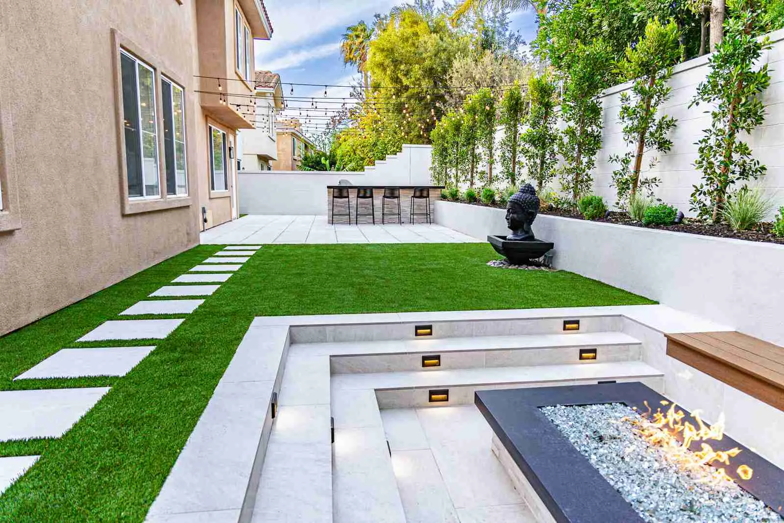 Sunken sitting area with fire pit and porcelain pavers, Irvine