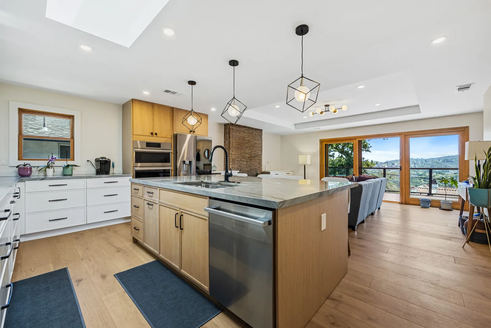 Kitchen with a stone backsplash and wood island, Belmont
