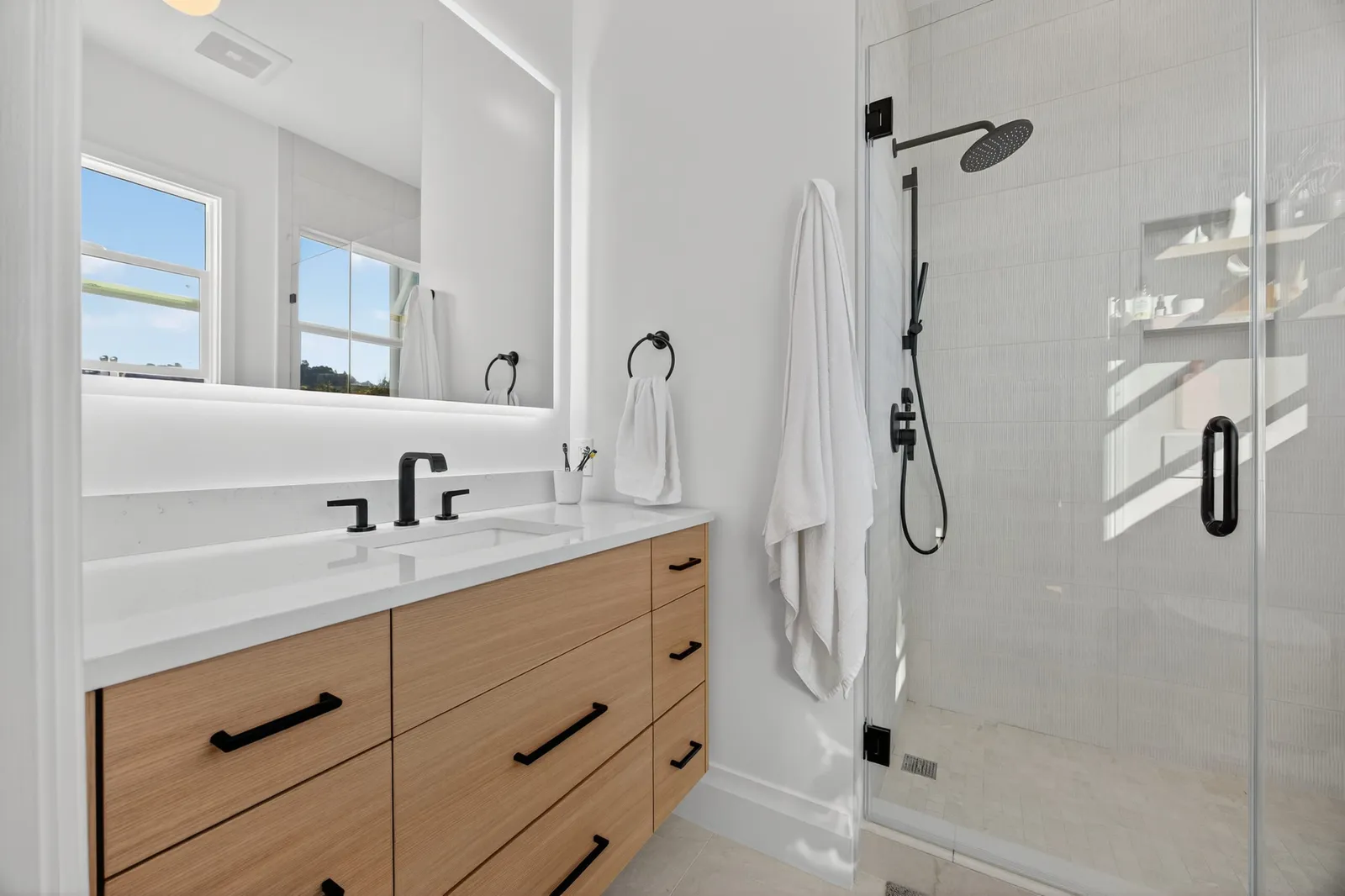 Bathroom with a wood vanity and glass shower, Noe Valley, San Francisco