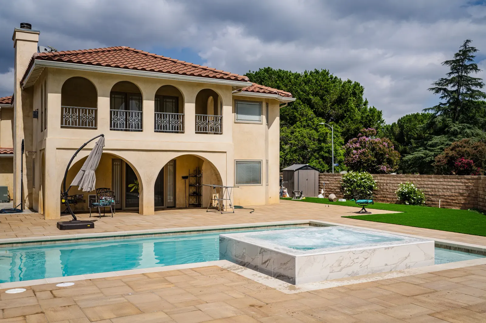 Rectangular pool with raised stone spa, West Hills