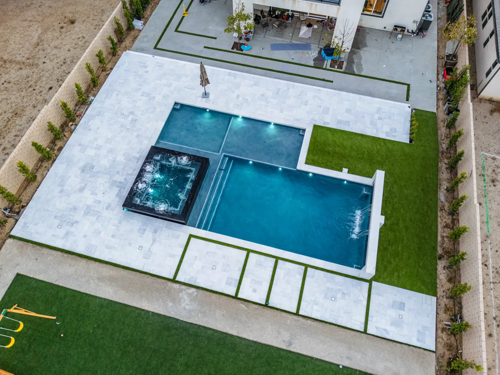 Pool, spa and marble paving with turf, Castaic