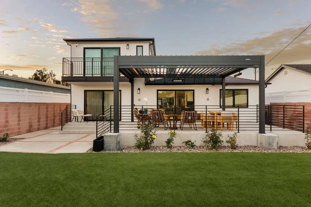 Rear of a remodeled two-story home with a louvered pergola, Playa Vista