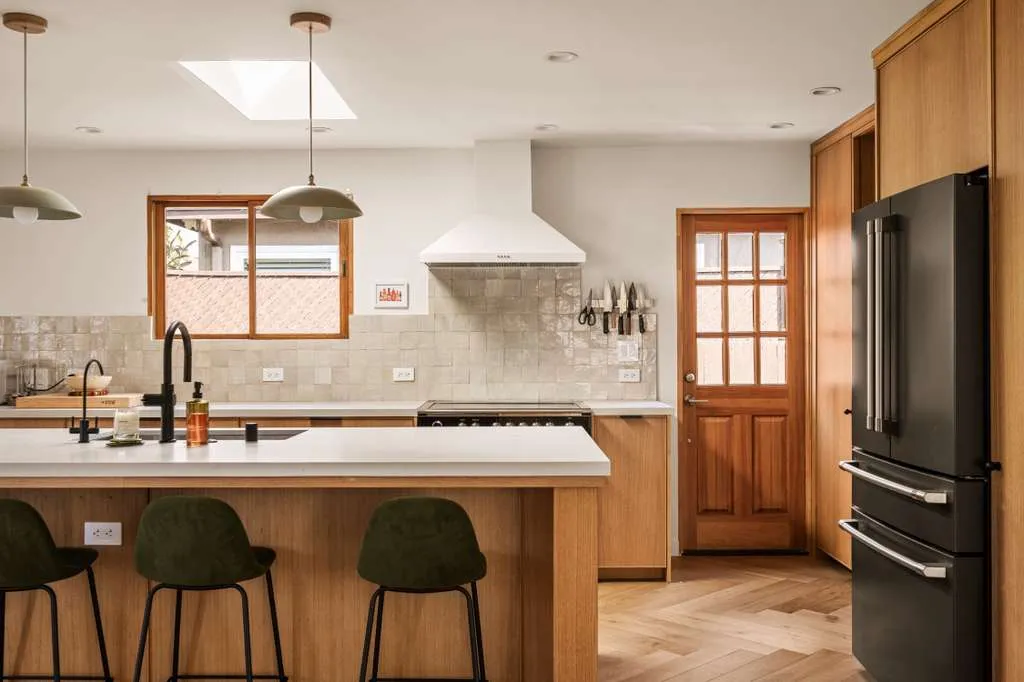 Kitchen with oak cabinetry and chevron wood floor, Westchester