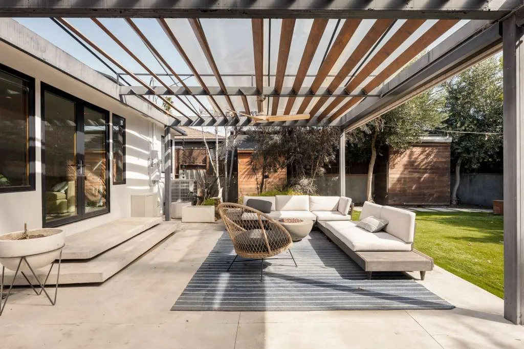 Covered patio under a slatted pergola, Westchester