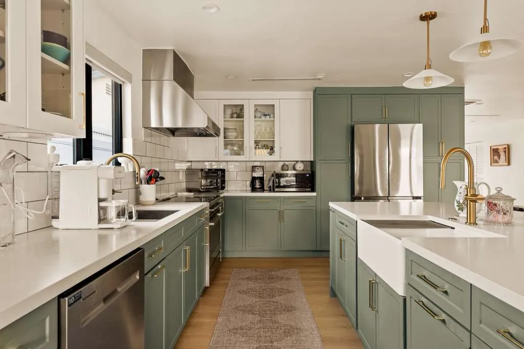 Remodeled kitchen with green cabinets and farmhouse sink, Playa Vista