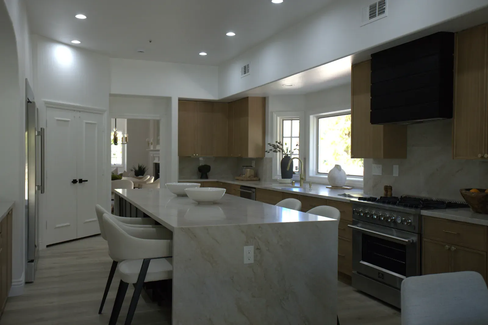 Kitchen with a Taj Mahal quartzite waterfall island, whole-house renovation, Laguna Hills