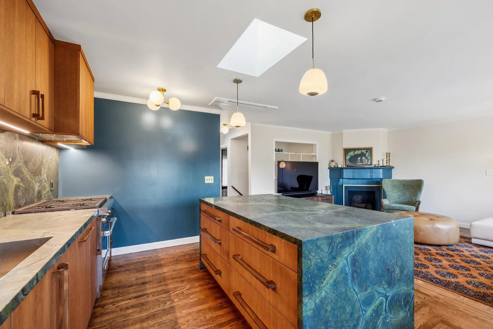 Quartzite waterfall island in a reconfigured open plan