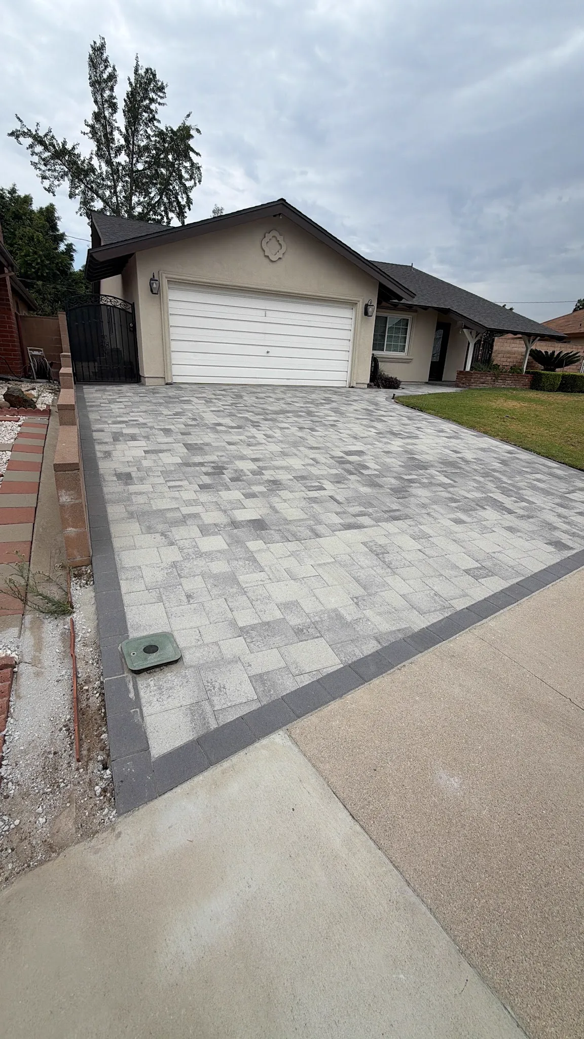New paver driveway with charcoal border