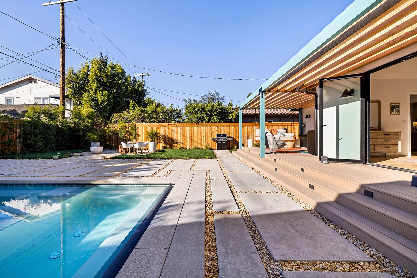 New pool and paver patio with pergola swing