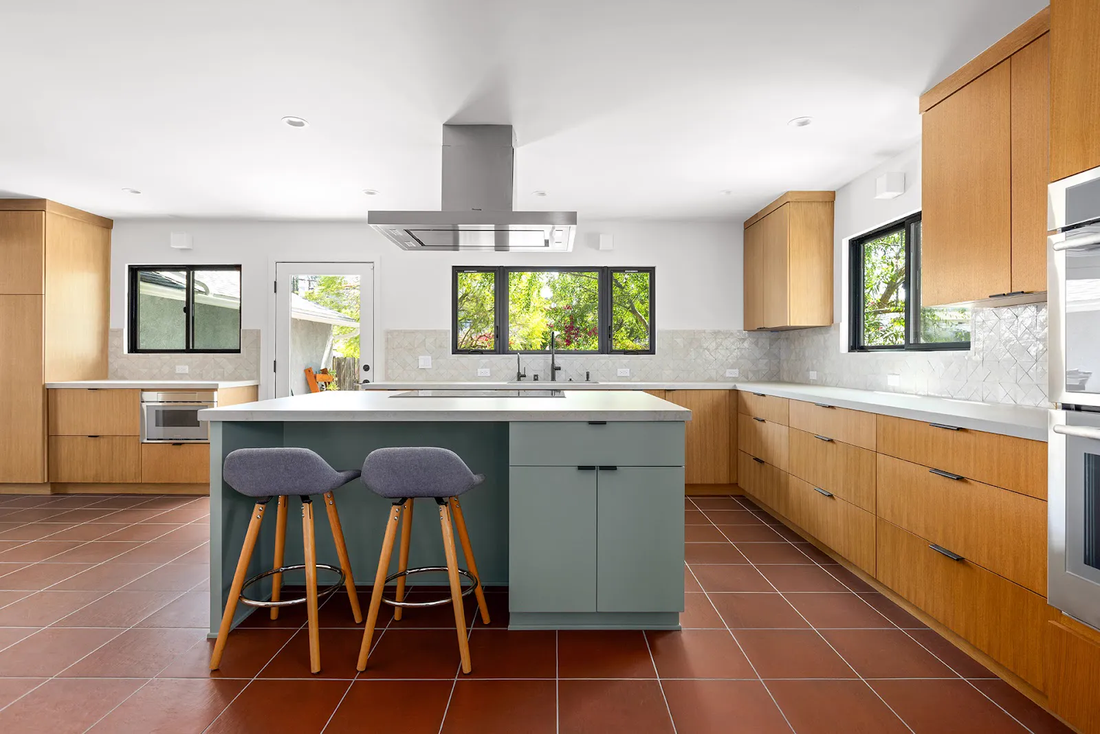 Kitchen remodel with sage green island and white oak cabinets