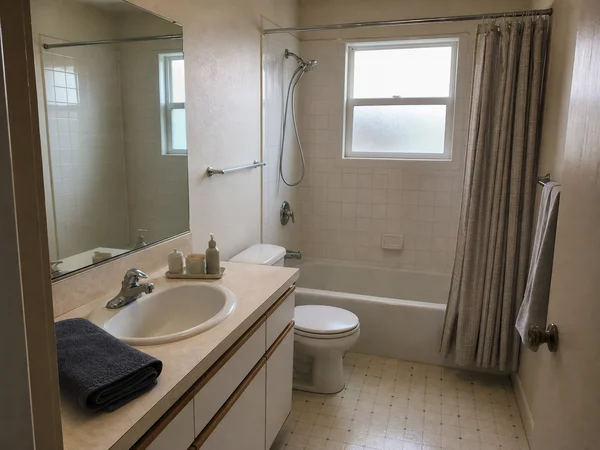 Before: builder-grade Seattle bathroom